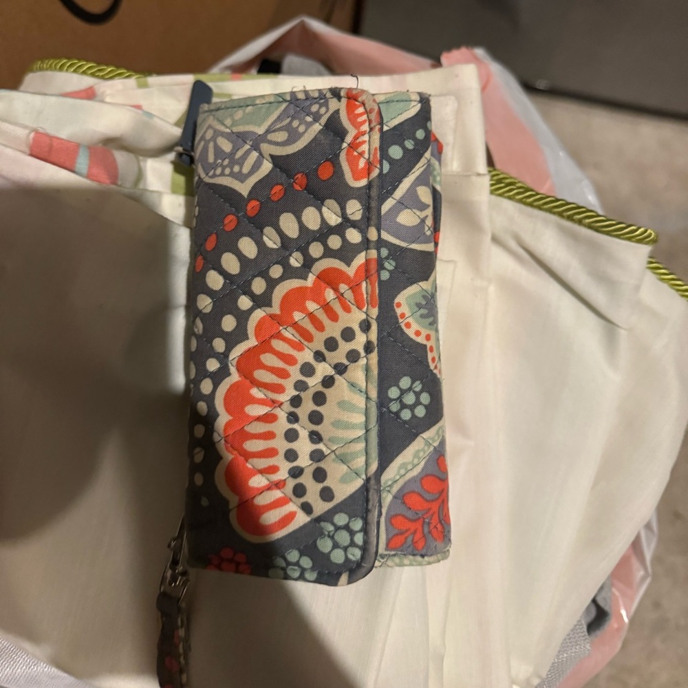 Teal, white, orange and grey wrist wallet from Vera Bradley